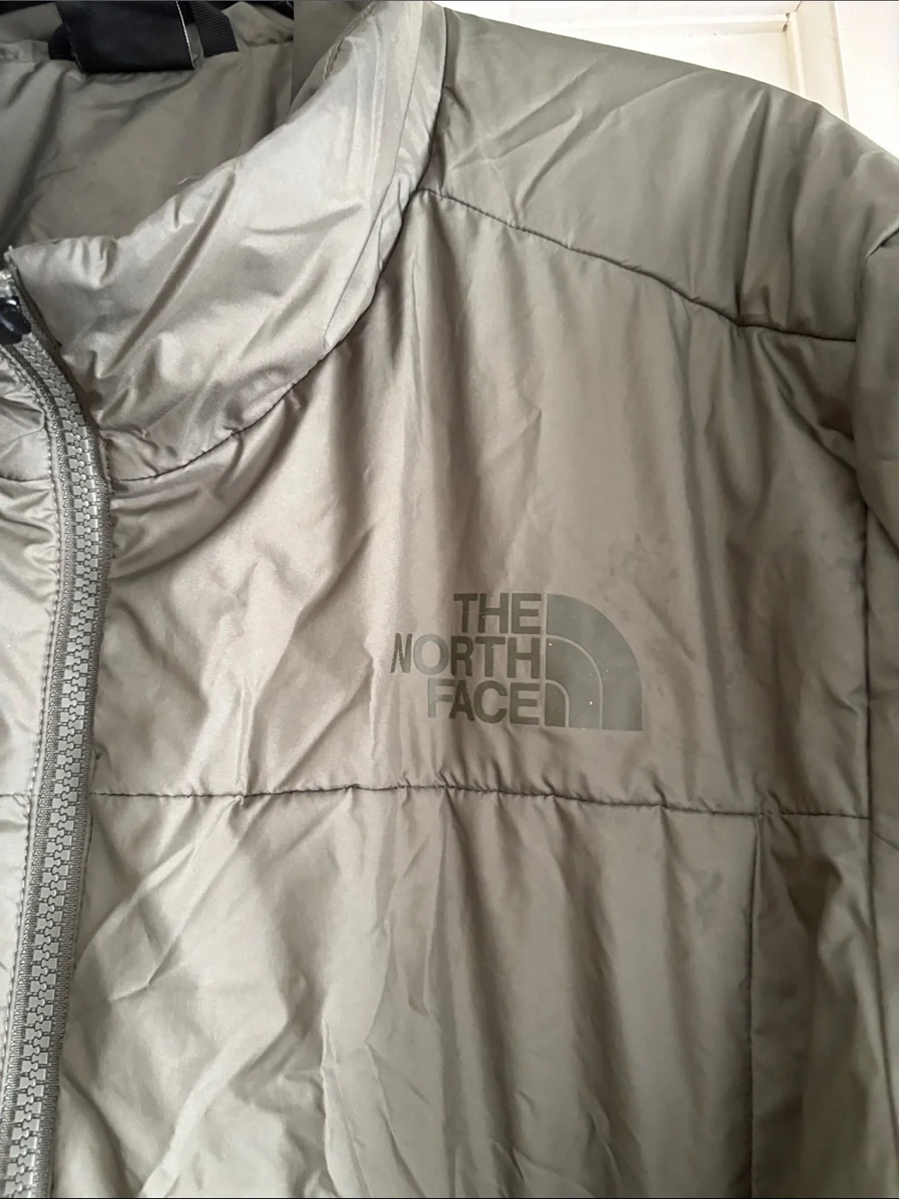 The North Face Men's Puffer Jacket - Olive Green light weight.